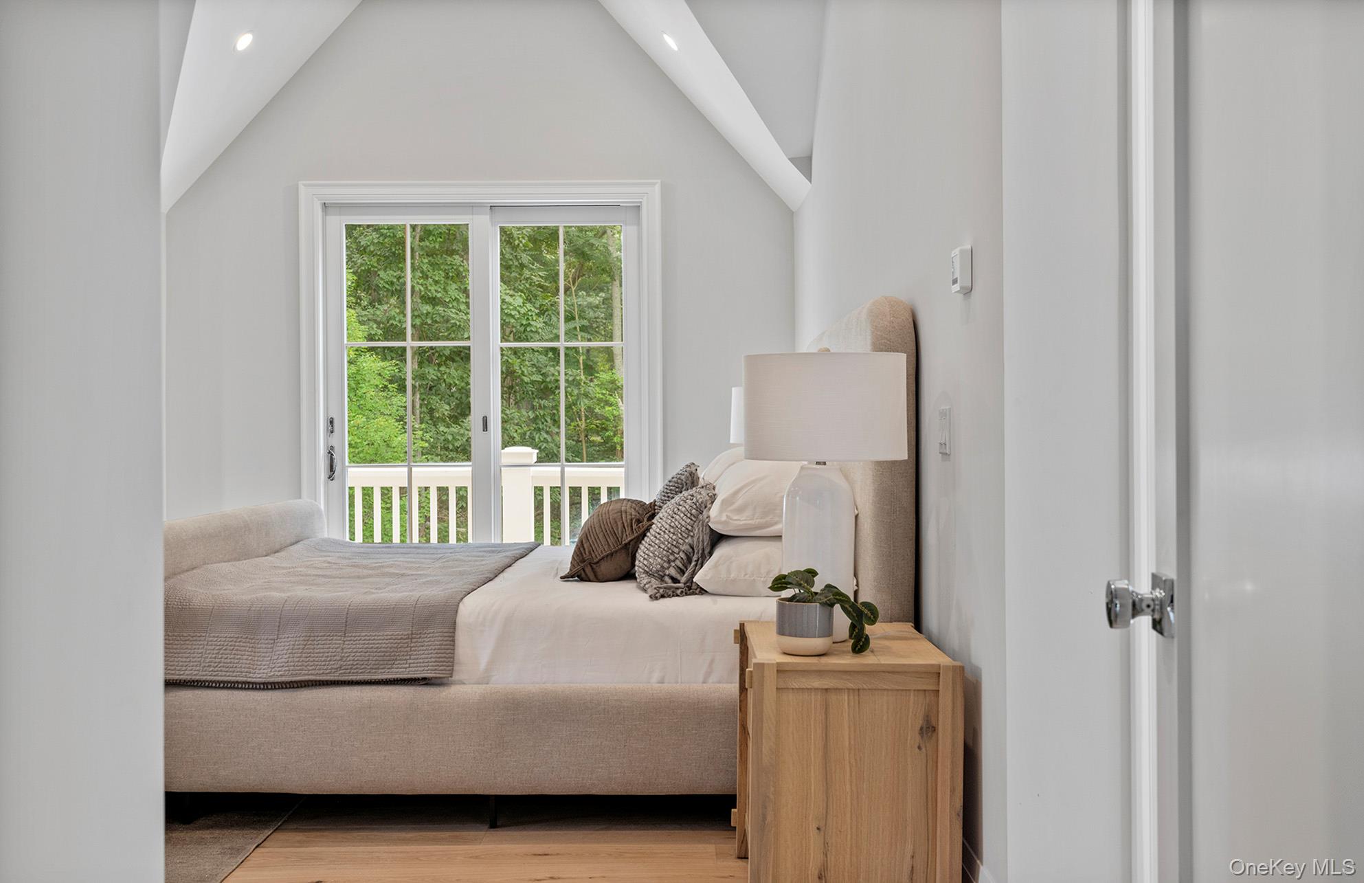 2524 Noyack Road Sag Harbor, NY 11963 - Photo 26 of 38 a bedroom with a bed and a window