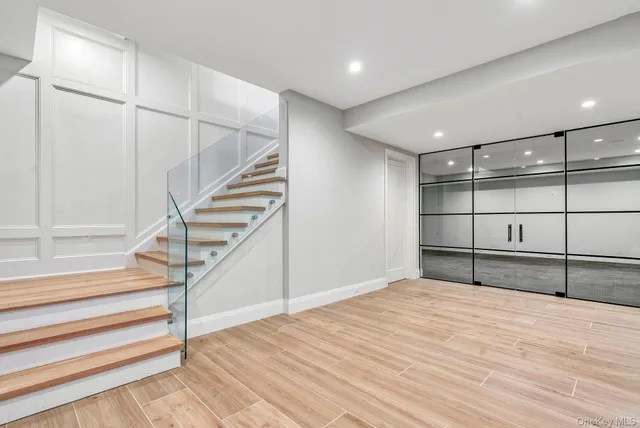 a view of a room with wooden floor and staircase