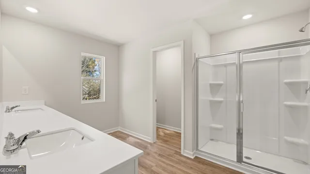 a bathroom with a sink and shower