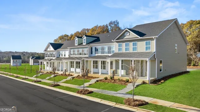 a front view of a house with a yard table and chairs