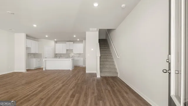 a view of kitchen with wooden floor