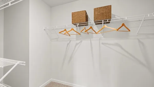 a room with gym equipment and white walls