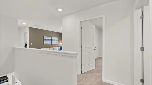 a living room with washing machine and sink