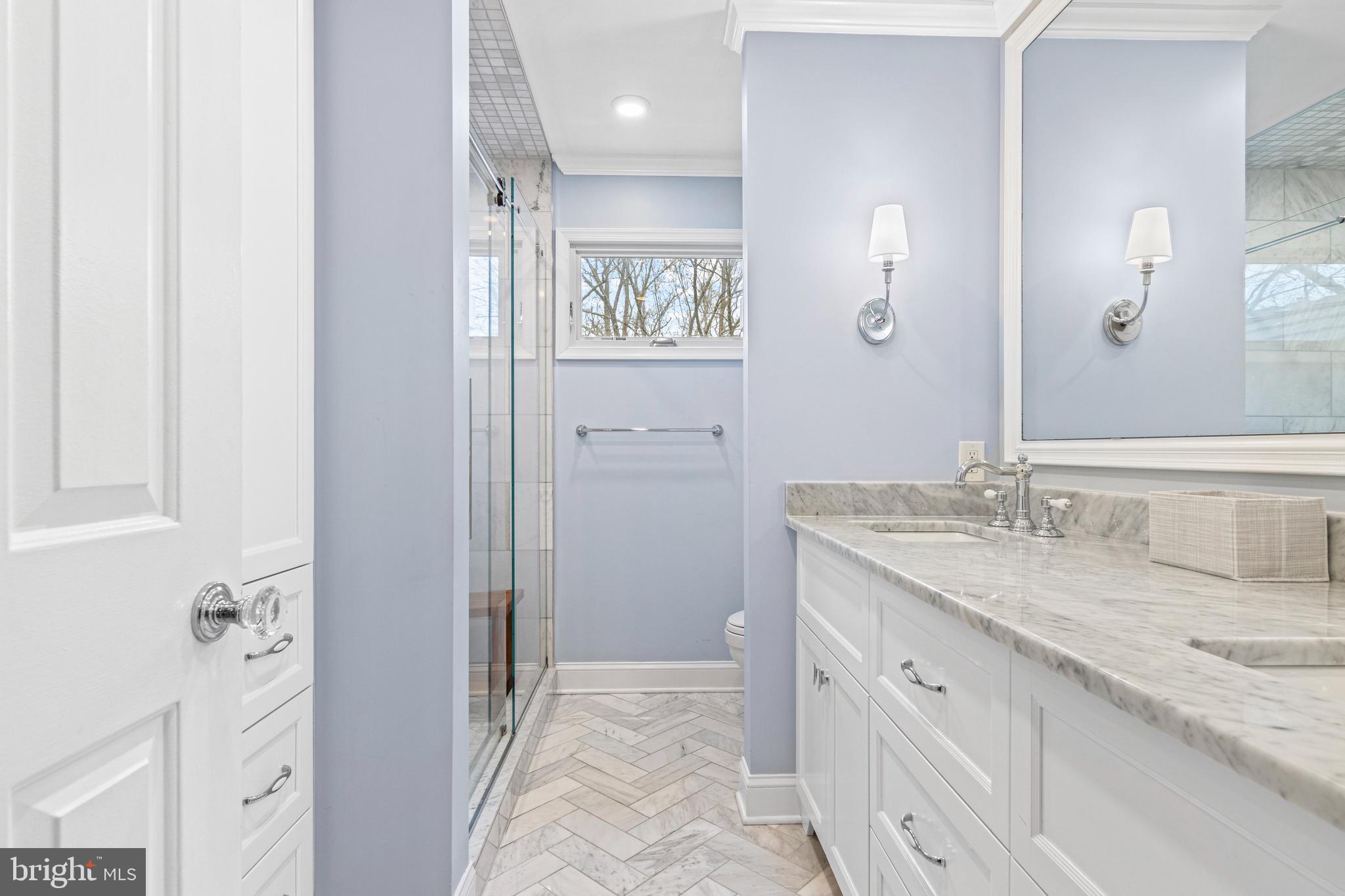 205 Ravenscliff Road Wayne, PA 19087 - Photo 46 of 65 a spacious bathroom with a granite countertop sink and a mirror