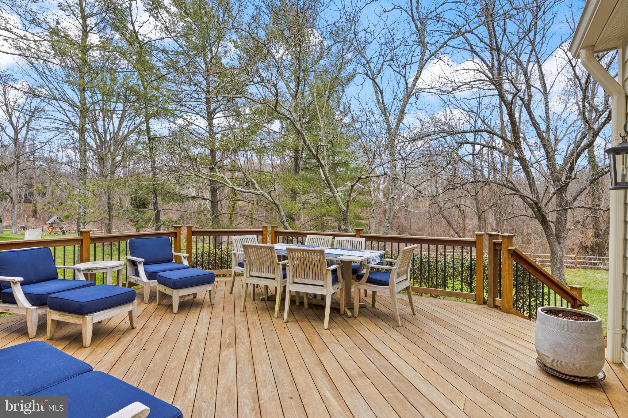 205 Ravenscliff Road Wayne, PA 19087 - Photo 55 of 65 a balcony with wooden floor table and chairs