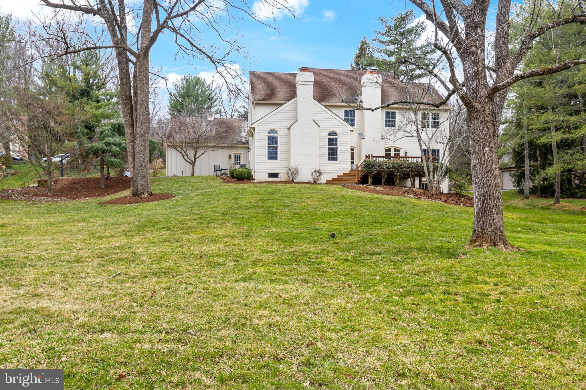 205 Ravenscliff Road Wayne, PA 19087 - Photo 6 of 65 a view of a white house with a yard