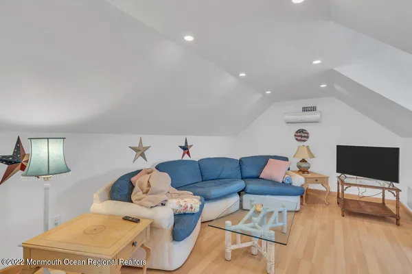 a bedroom with two beds and a lamp