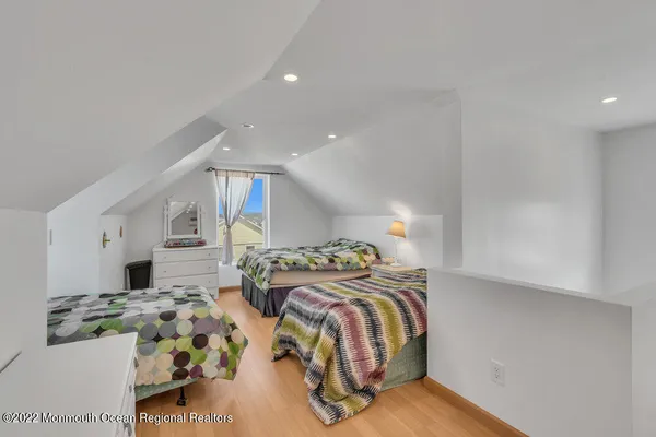 a bedroom with bed and a lamp