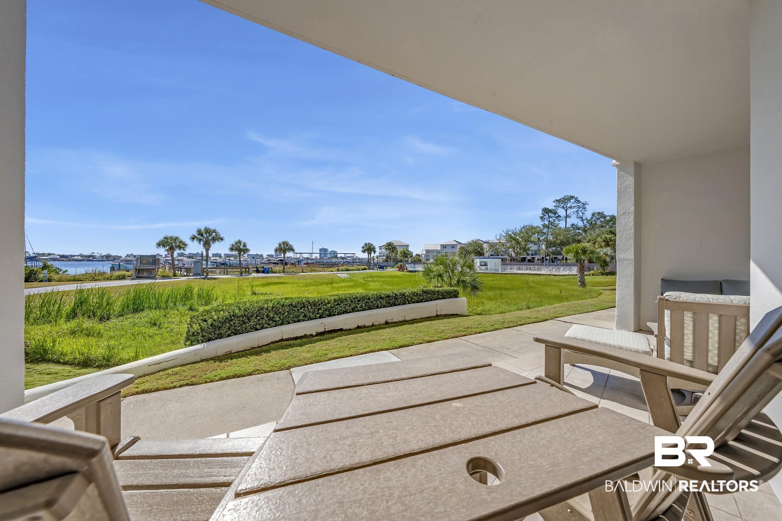 27282 Canal Road, Unit 104 Orange Beach, AL 36561 - Photo 41 of 79 View of patio with a water view