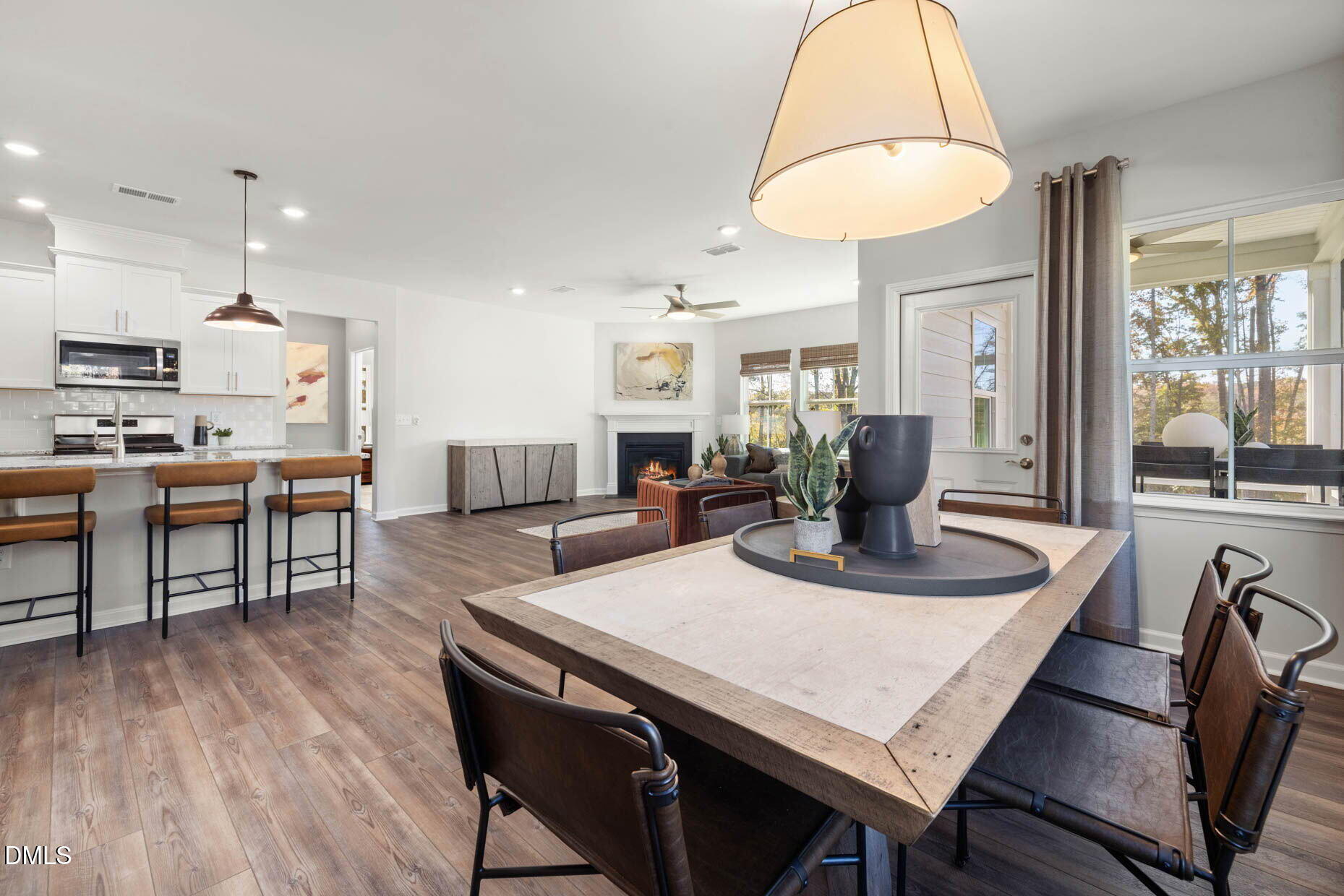360 Broomside Avenue Raleigh, NC 27603 - Photo 7 of 35 a dining room with furniture a chandelier and wooden floor