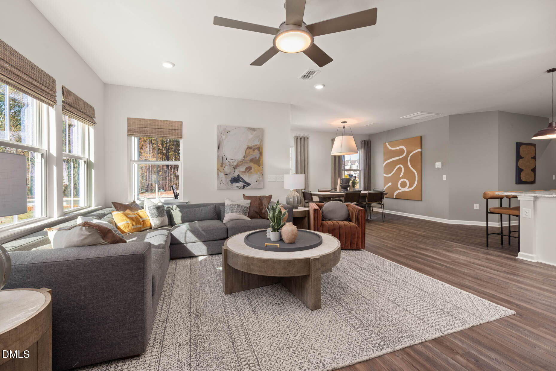 360 Broomside Avenue Raleigh, NC 27603 - Photo 8 of 35 a living room with furniture a window and a chandelier