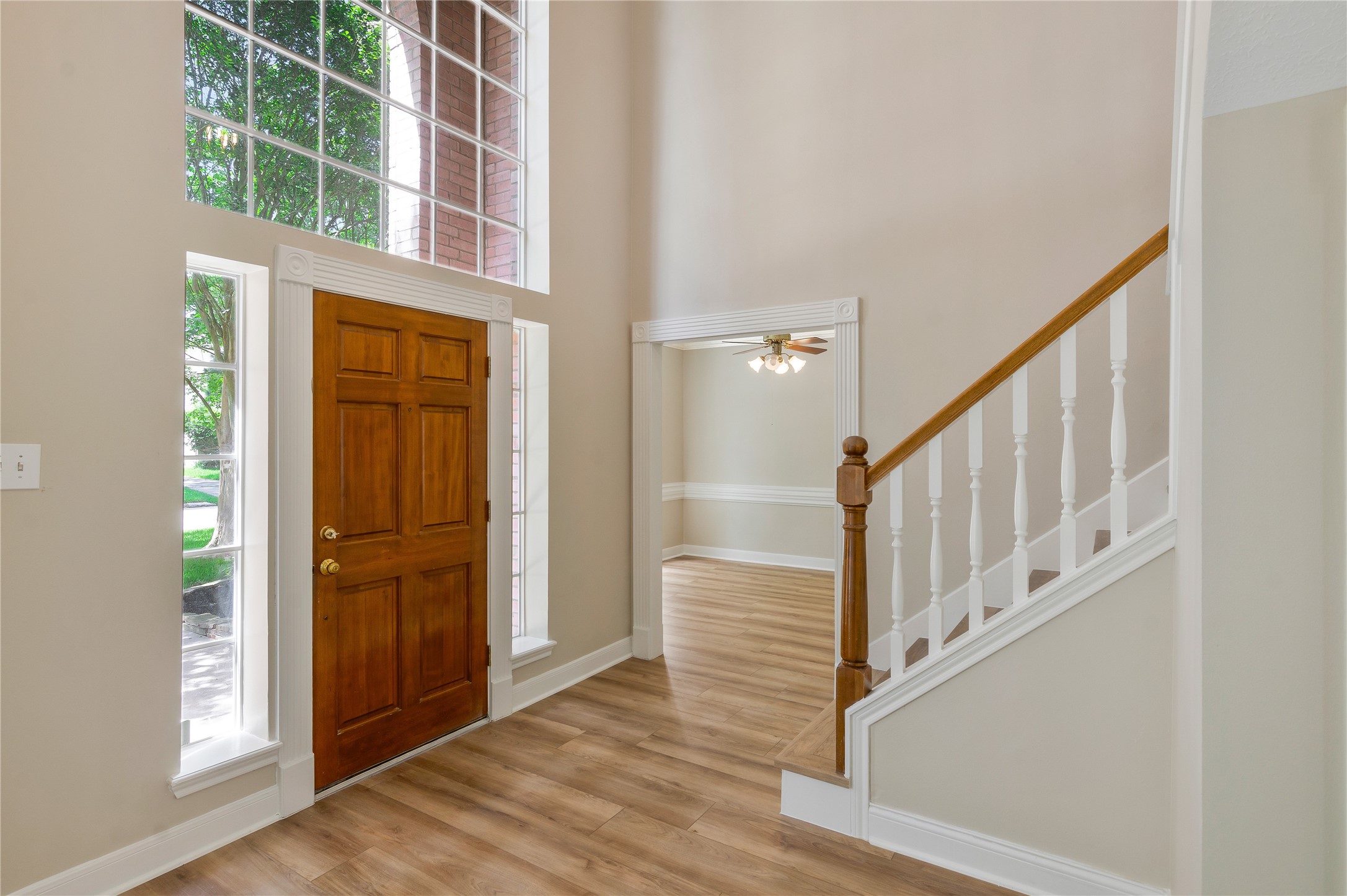 8011 Null Court Spring, TX 77379 - Photo 4 of 41 Beautiful entry with windows that allow all the natural light into the entry of the home.