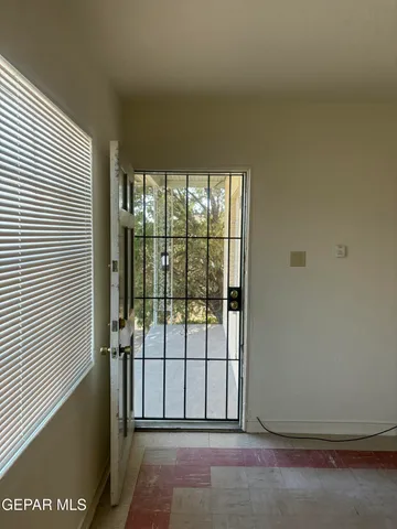 a view of a hallway with white walls