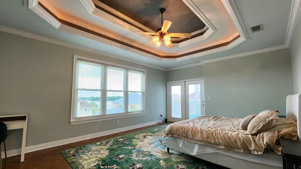 a bedroom with bed and a window
