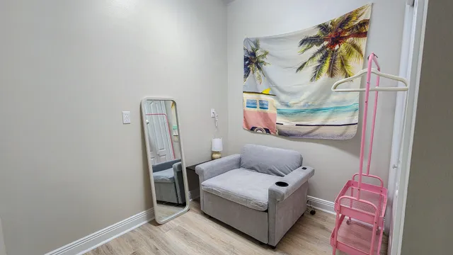 a bathroom with a shower sink vanity mirror and toilet