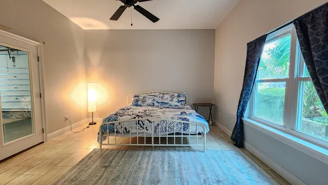 a bathroom with a sink mirror and toilet