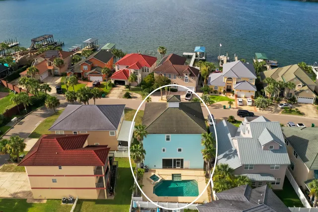 an aerial view of a house with a ocean view