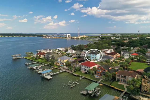 a view of a lake with a yard and a fountain