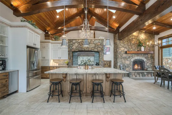 a kitchen with sink stove and cabinets