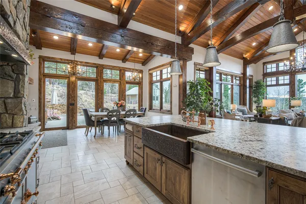 a kitchen with stainless steel appliances granite countertop a stove and a sink