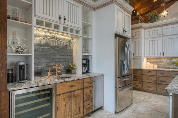 a kitchen with stainless steel appliances granite countertop a stove and a sink