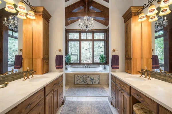 a bathroom with a granite countertop shower a sink and a toilet