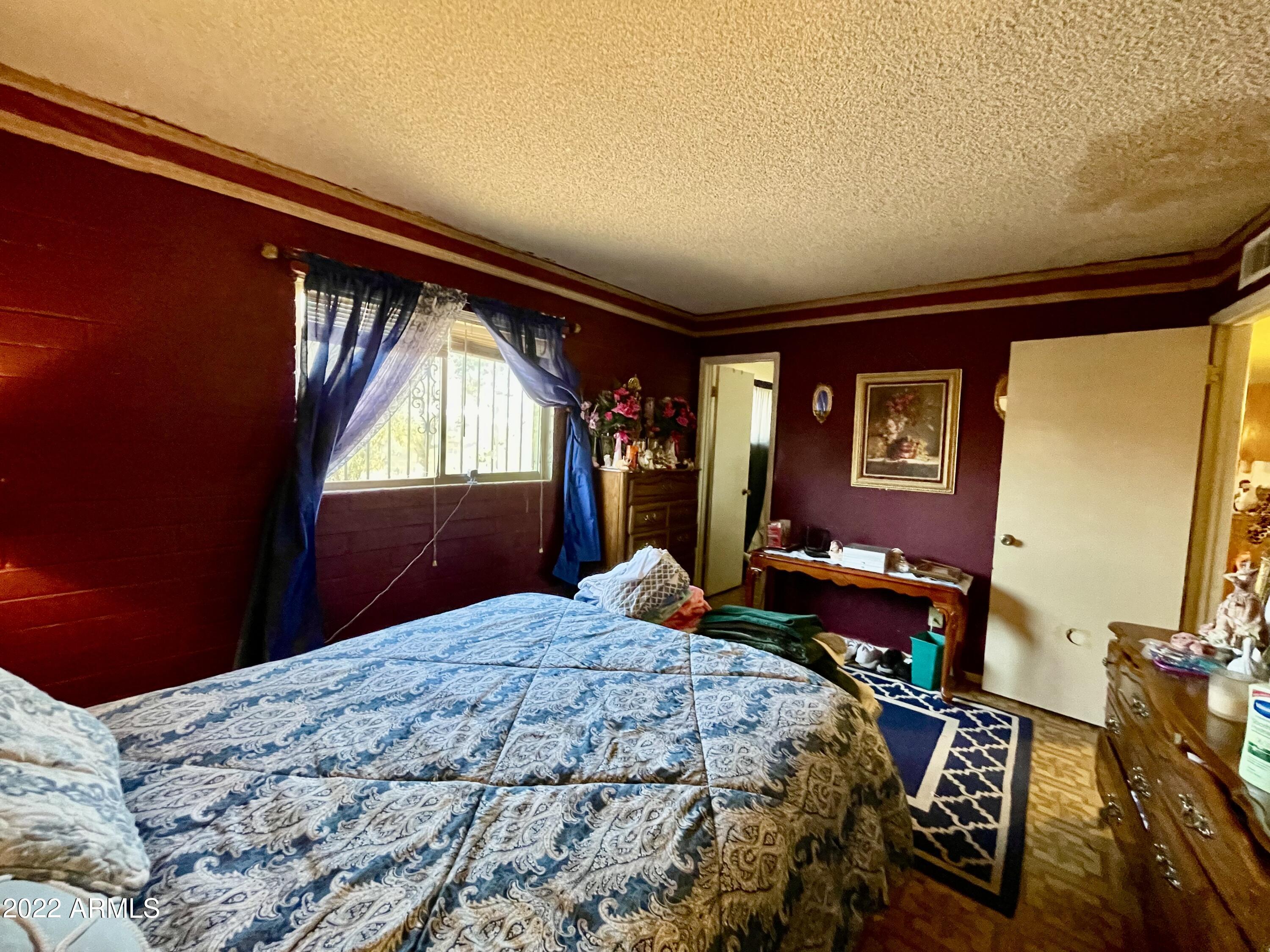 1713 West Vineyard Road Phoenix, AZ 85041 - Photo 8 of 21 Master bedroom