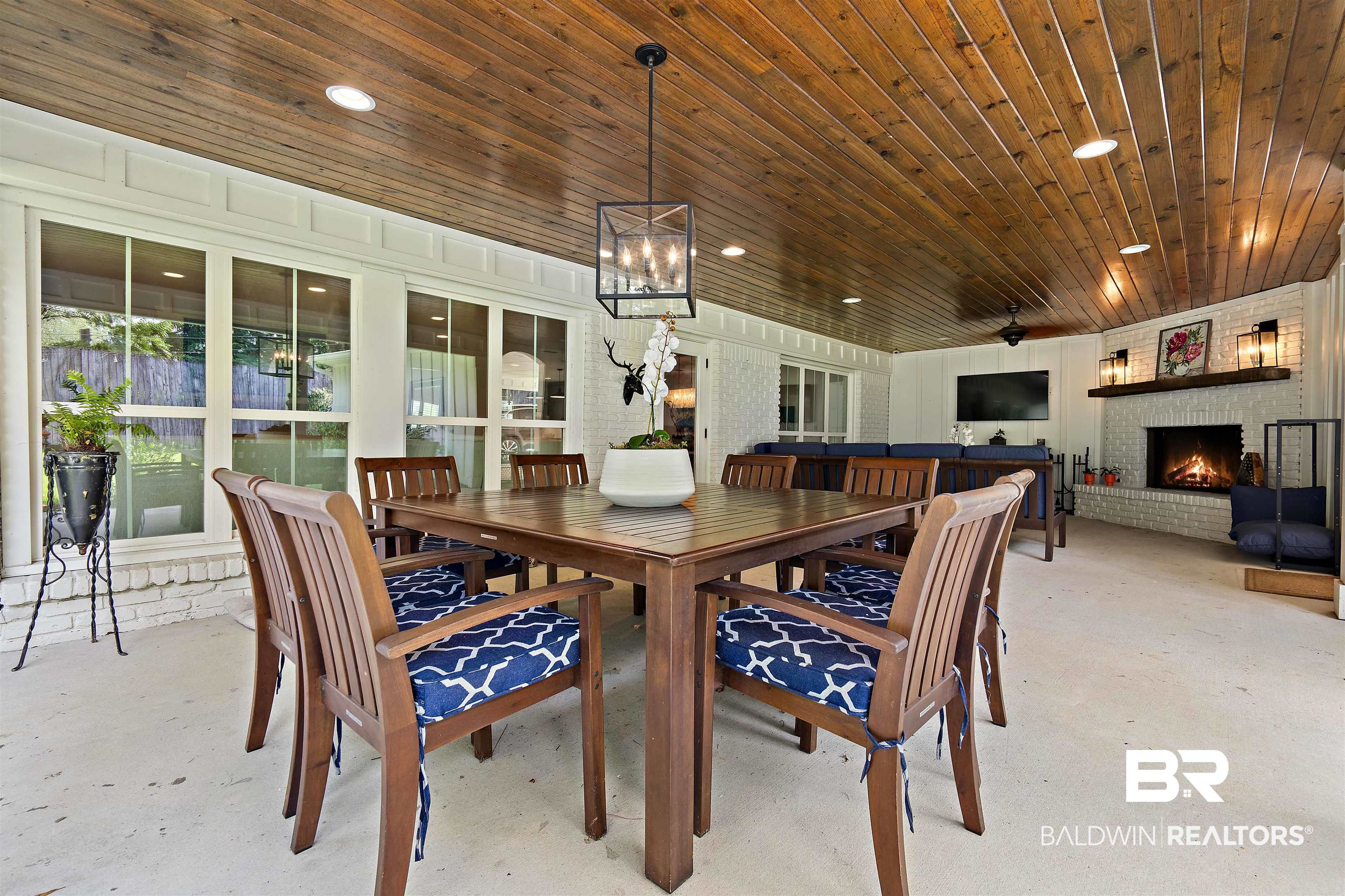 3808 Claridge Road North Mobile, AL 36608 - Photo 38 of 43 Dining room featuring a notable chandelier, a brick fireplace, and wood ceiling