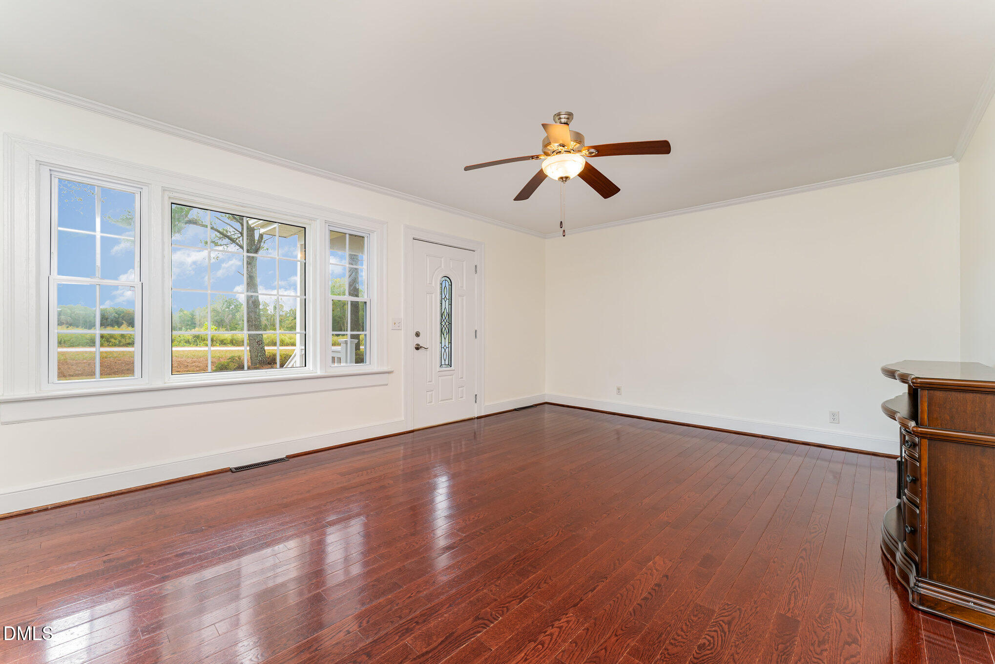 9670 Valley Road Middlesex, NC 27557 - Photo 12 of 22 a view of an empty room with a window and wooden floor