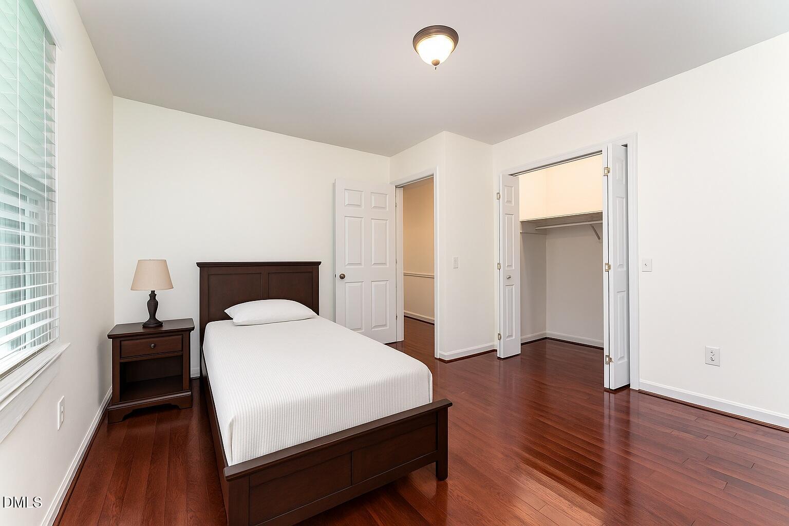 9670 Valley Road Middlesex, NC 27557 - Photo 19 of 22 a bedroom with a bed and a table