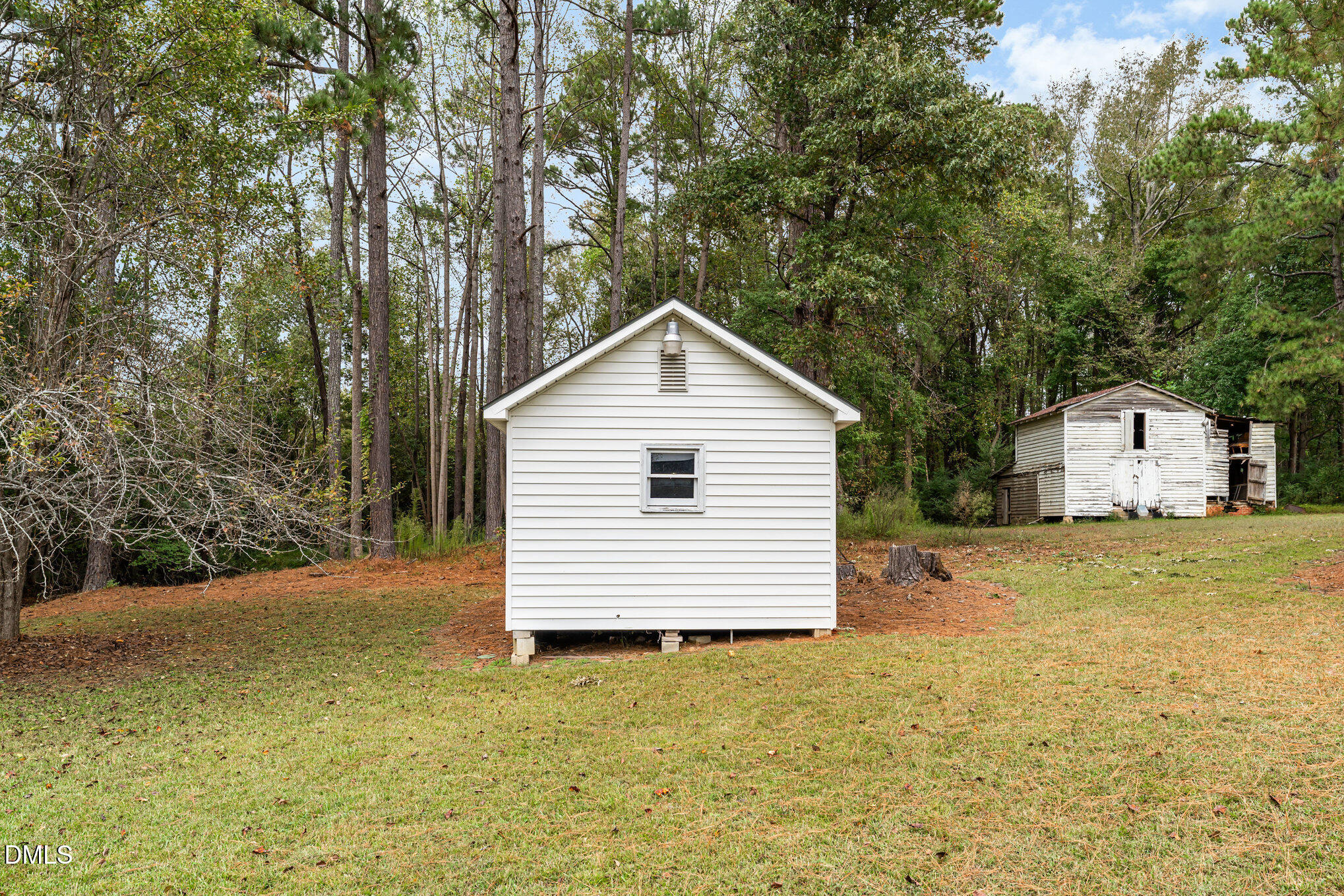 9670 Valley Road Middlesex, NC 27557 - Photo 22 of 22 a view of a house with a yard and garage