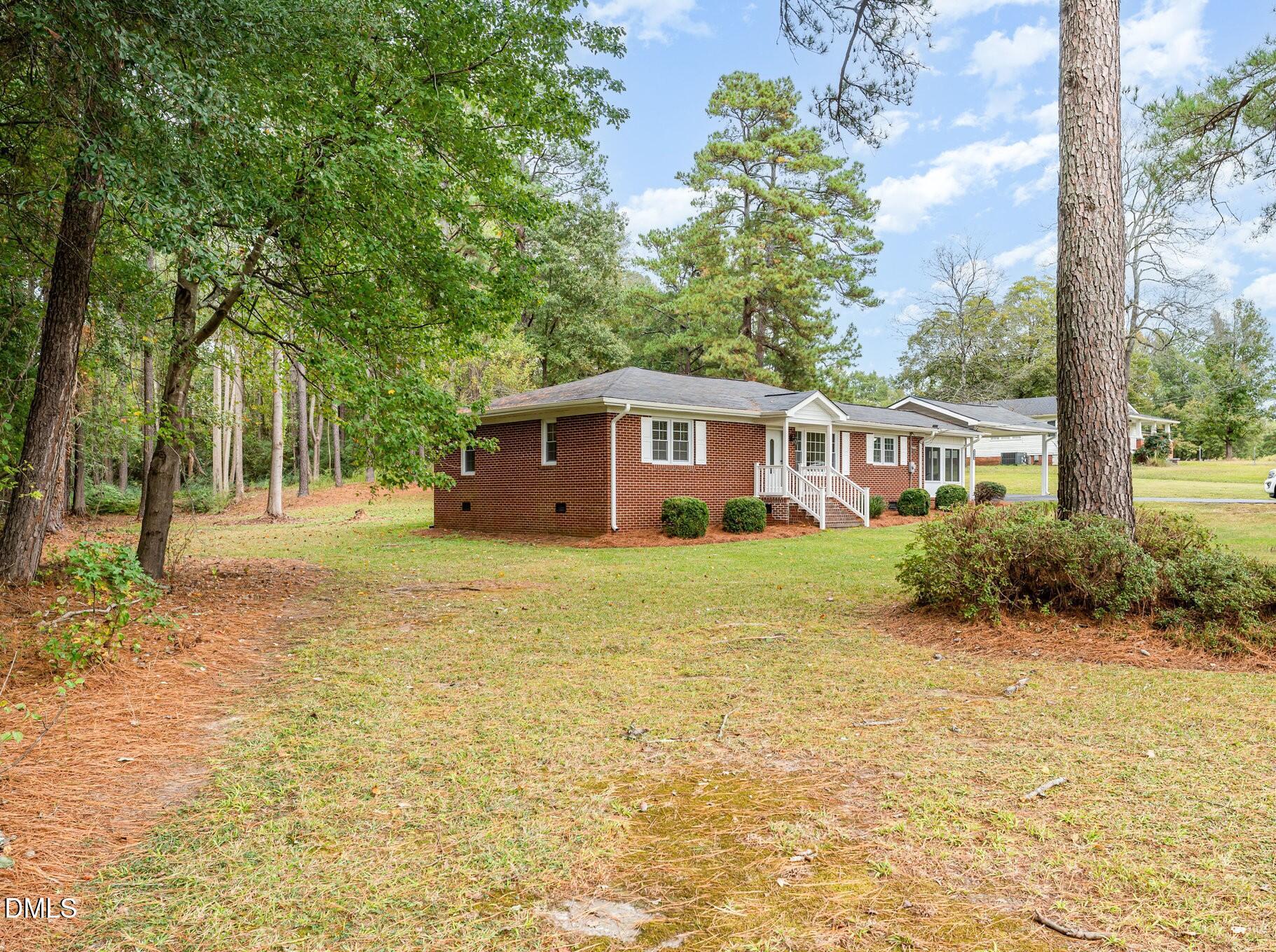 9670 Valley Road Middlesex, NC 27557 - Photo 3 of 22 a front view of house with yard and green space
