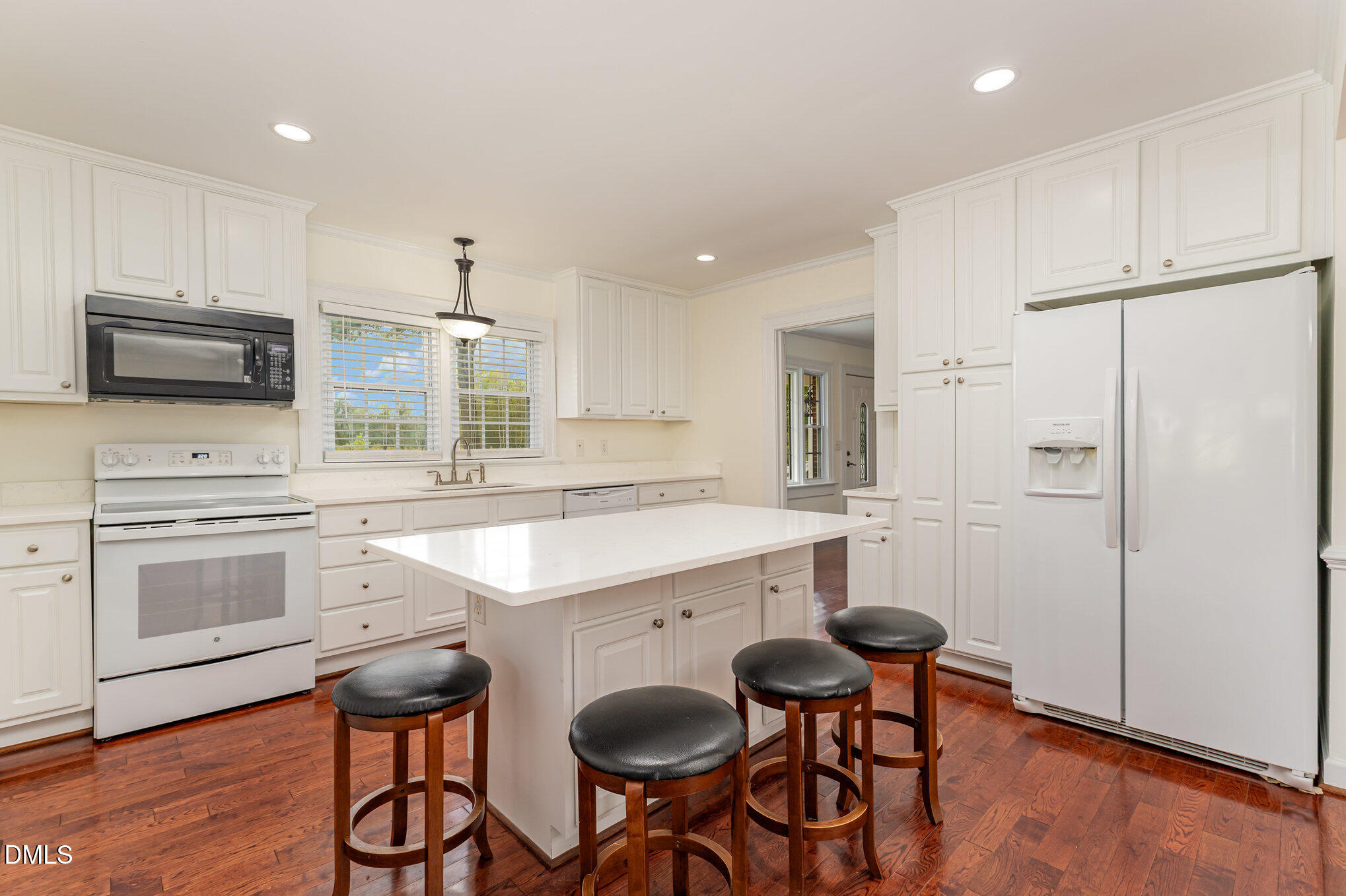 9670 Valley Road Middlesex, NC 27557 - Photo 5 of 22 a kitchen with stainless steel appliances a stove a sink cabinets and a refrigerator