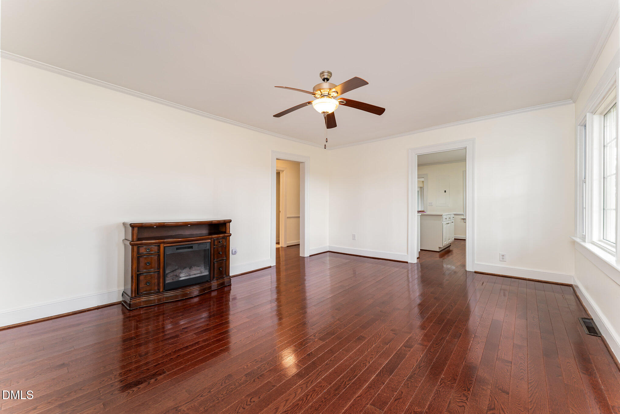 9670 Valley Road Middlesex, NC 27557 - Photo 10 of 22 a view of empty room with wooden floor and fan