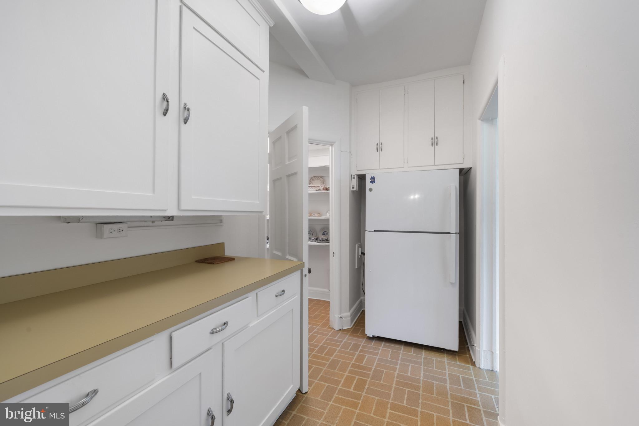 6 Upland Road, Unit F5 Baltimore, MD 21210 - Photo 13 of 31 a kitchen with a refrigerator and a sink