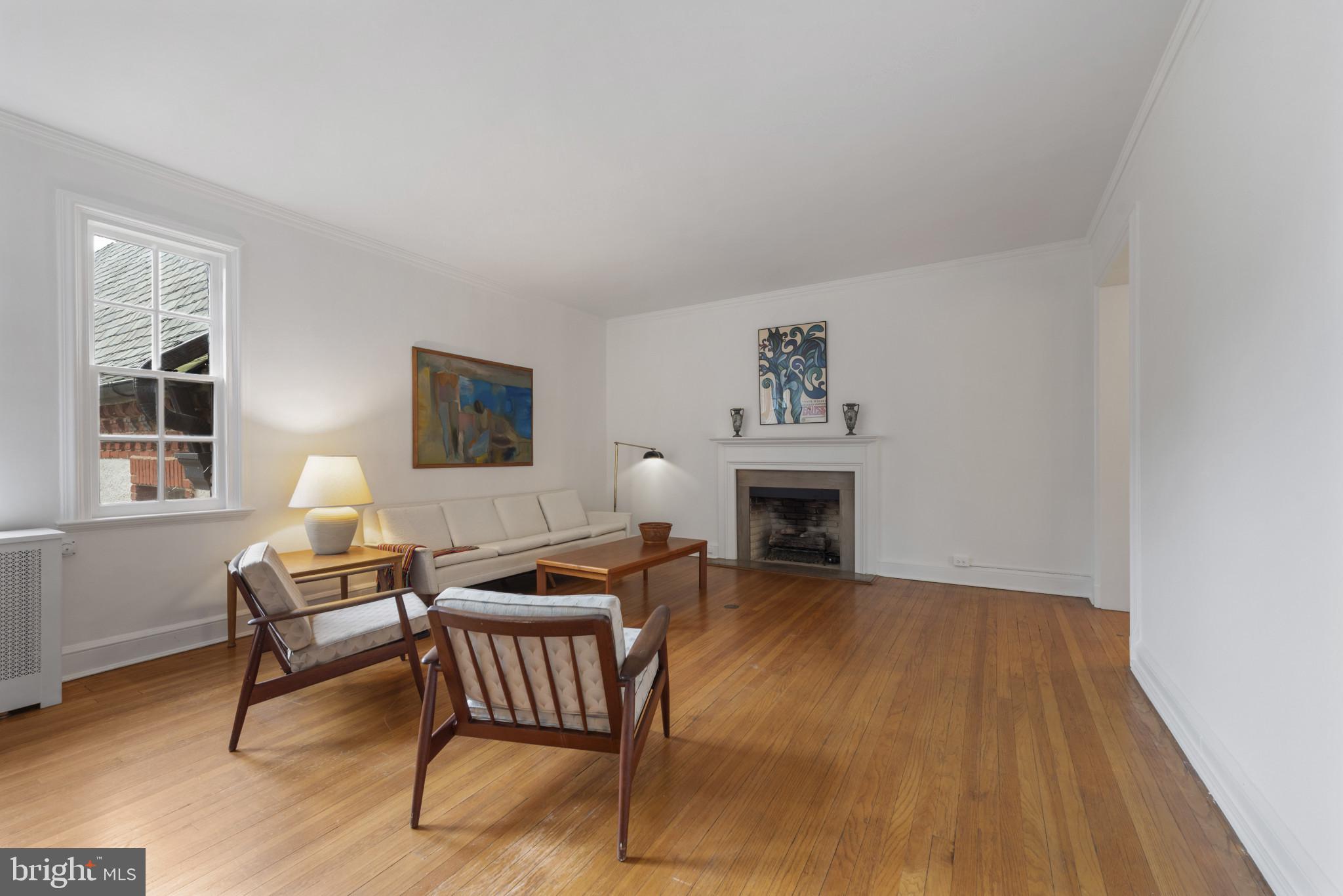 6 Upland Road, Unit F5 Baltimore, MD 21210 - Photo 16 of 31 a living room with furniture and a fireplace