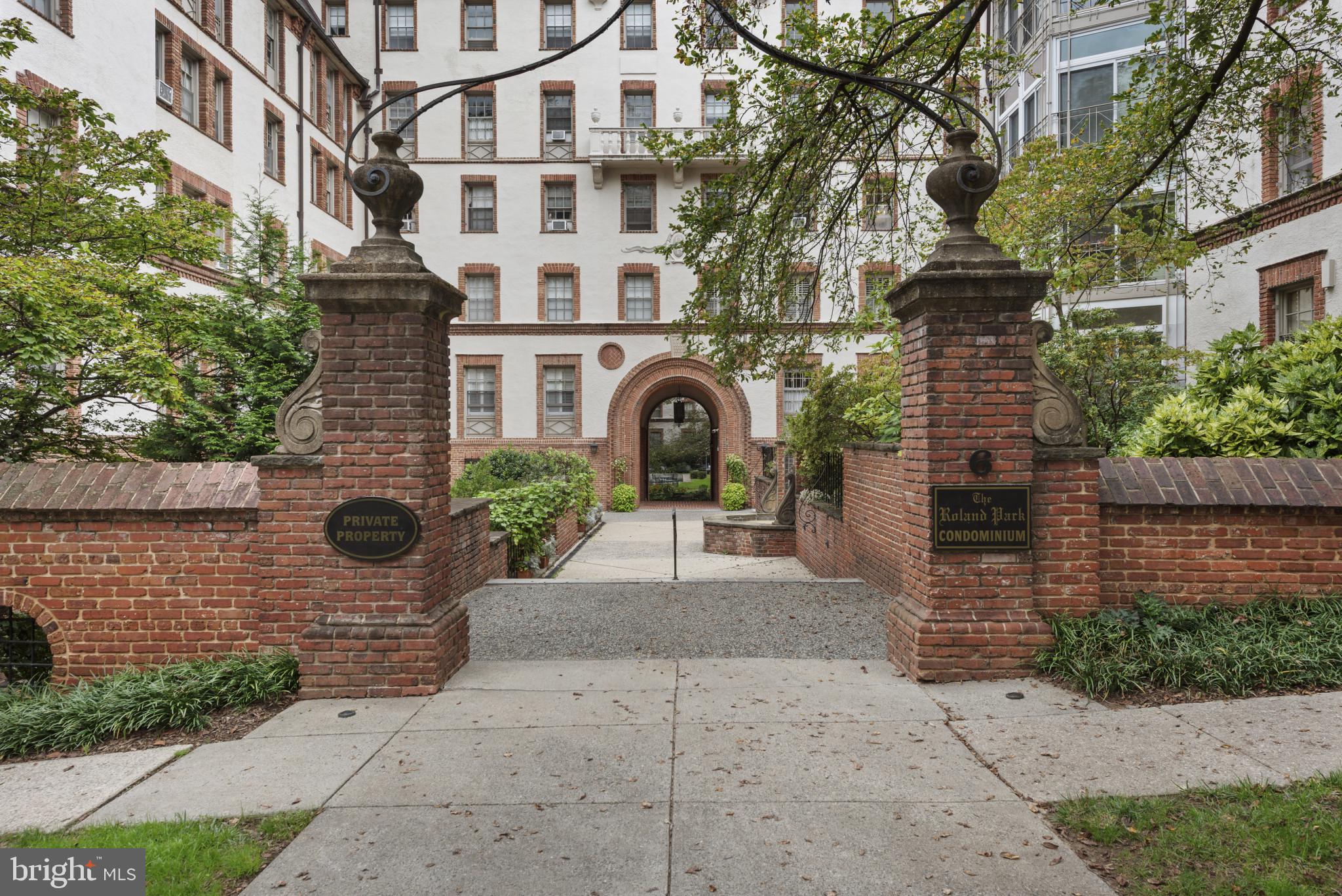 6 Upland Road, Unit F5 Baltimore, MD 21210 - Photo 2 of 31 a view of a brick house with many windows