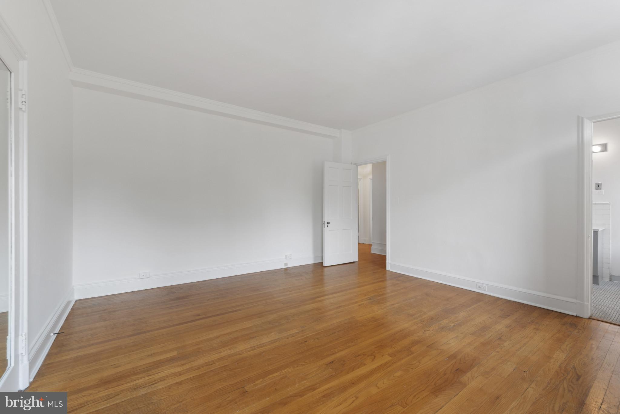 6 Upland Road, Unit F5 Baltimore, MD 21210 - Photo 26 of 31 a view of an empty room and wooden floor