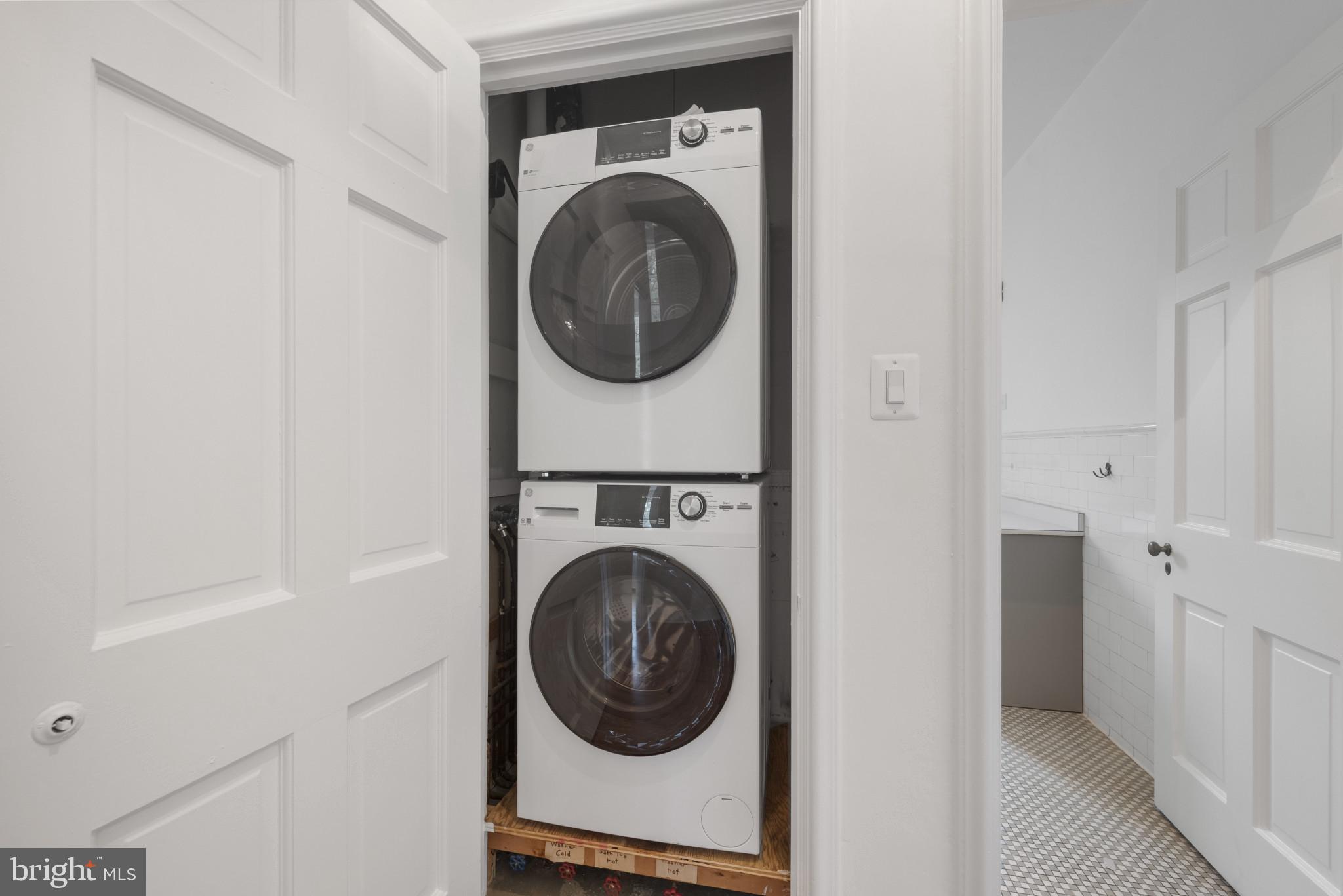 6 Upland Road, Unit F5 Baltimore, MD 21210 - Photo 28 of 31 a utility room with dryer and washer
