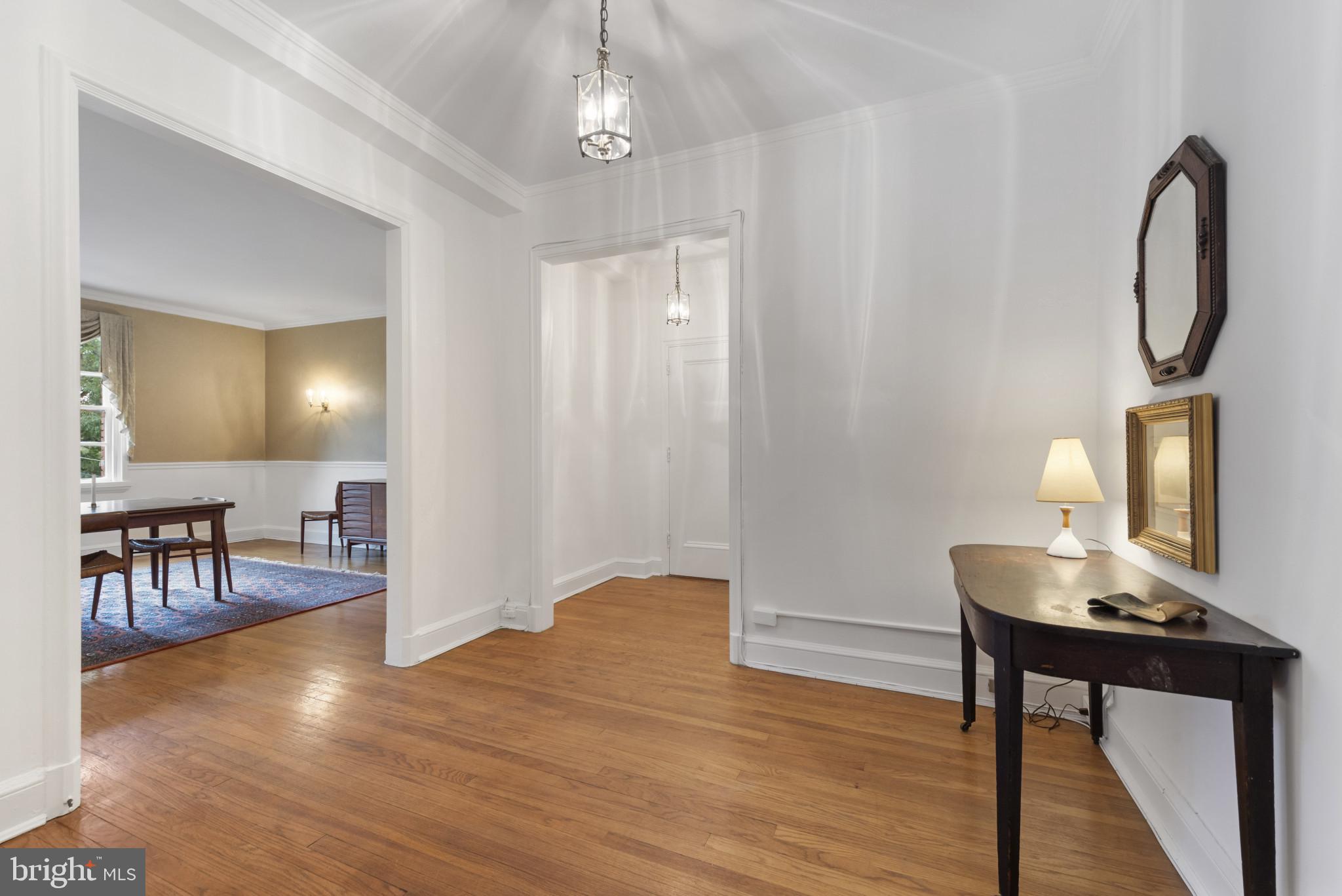 6 Upland Road, Unit F5 Baltimore, MD 21210 - Photo 5 of 31 a workspace with wooden floor and furniture