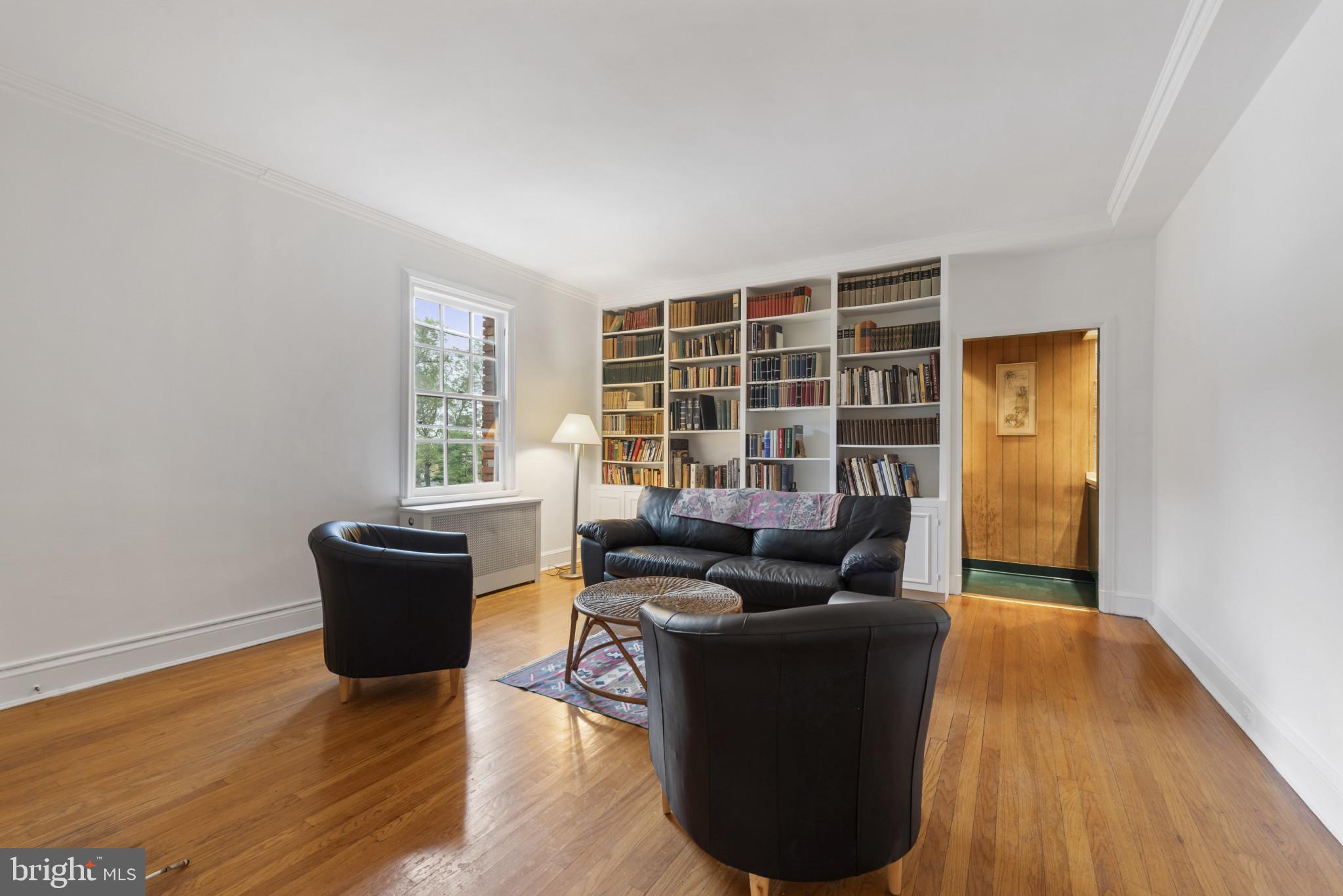 6 Upland Road, Unit F5 Baltimore, MD 21210 - Photo 6 of 31 a living room with furniture and a potted plant