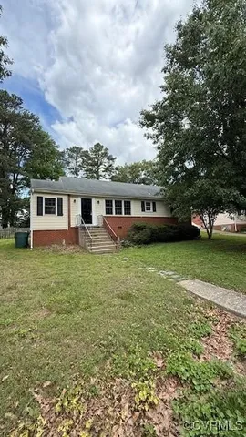 a view of a house with a garden