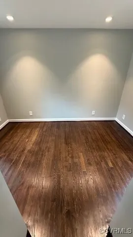 a view of room with wooden floor