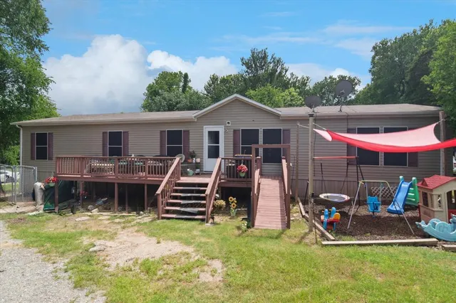 a view of a patio with a table and chairs