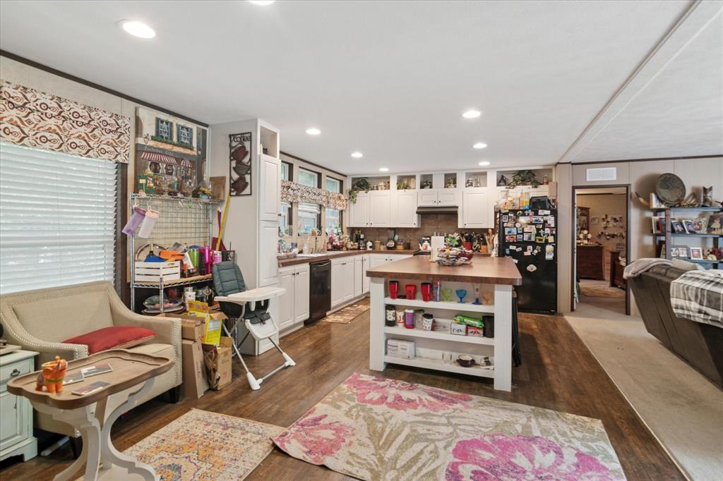 4804 Creekside Road Melissa, TX 75454 - Photo 4 of 17 a living room with furniture and a flat screen tv