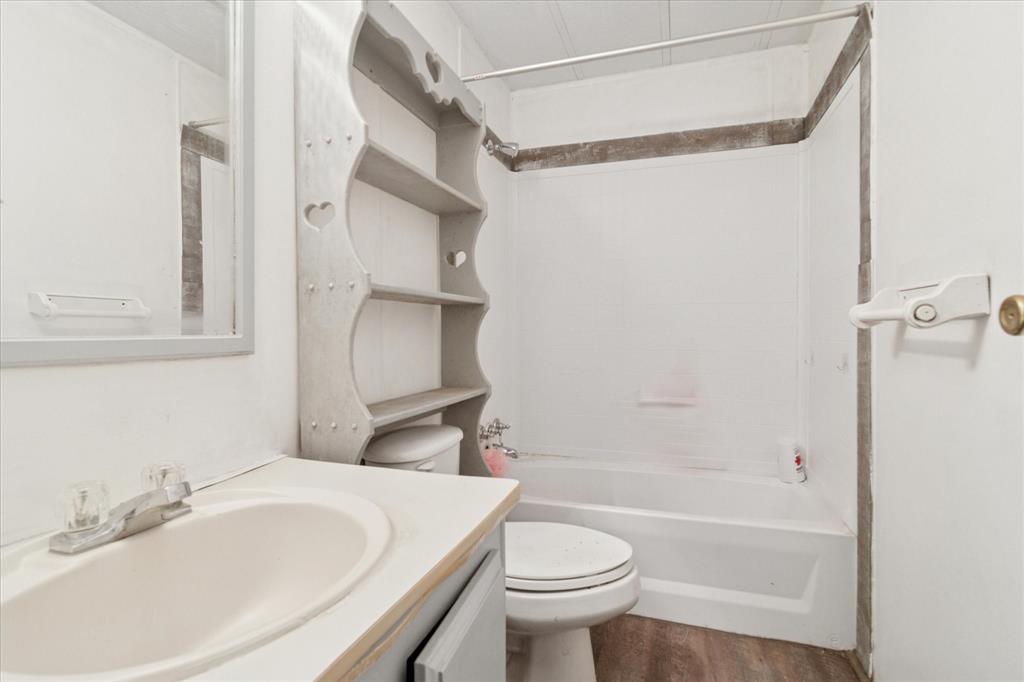 4804 Creekside Road Melissa, TX 75454 - Photo 8 of 17 a bathroom with a sink toilet and shower