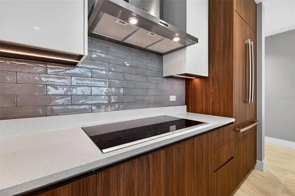 a kitchen with a sink and cabinets