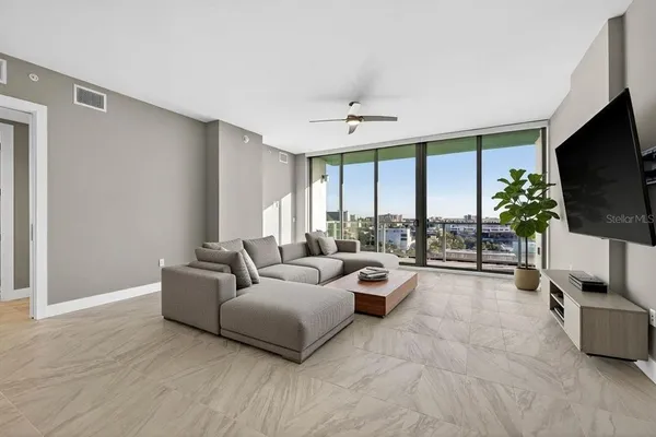 a living room with furniture and a flat screen tv