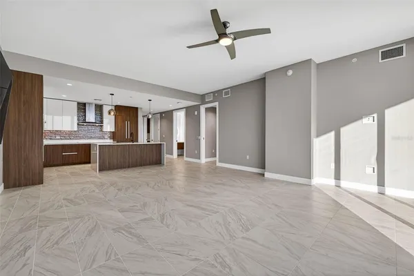 a view of a kitchen with a sink and a window