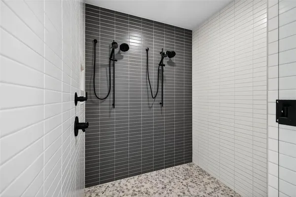 a bedroom with a bed and a ceiling fan